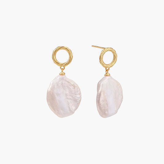18K gold vermeil twisted circle studs with organic white baroque pearl drops on cream background