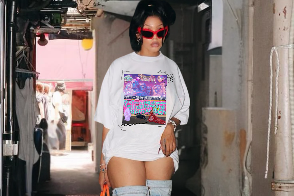 Person wearing a white graphic sweatshirt and light blue jeans in an urban setting