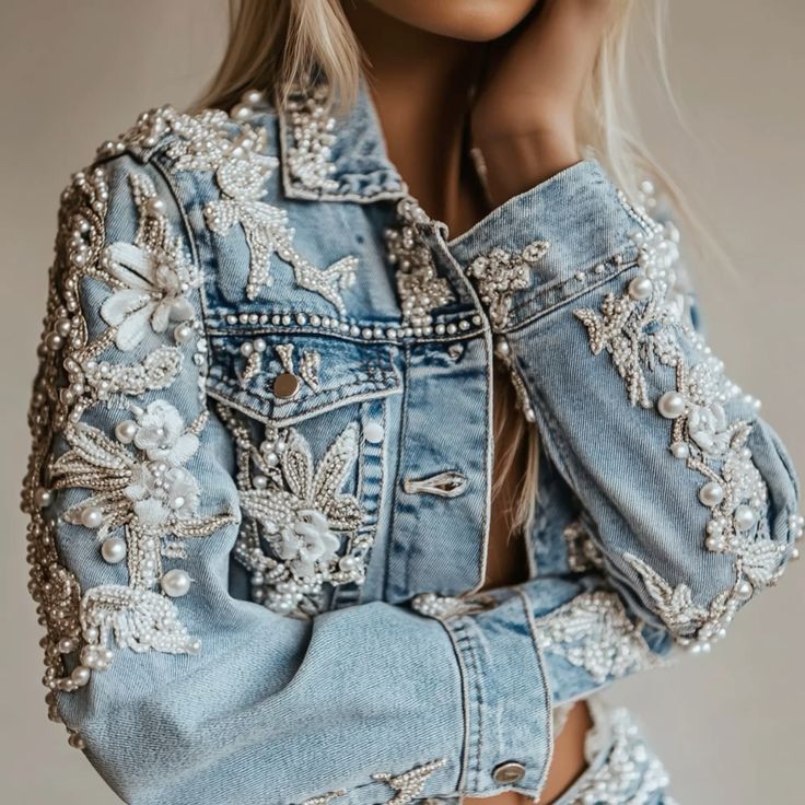 HOK_Denim jacket with floral embellishments and beads on a neutral background